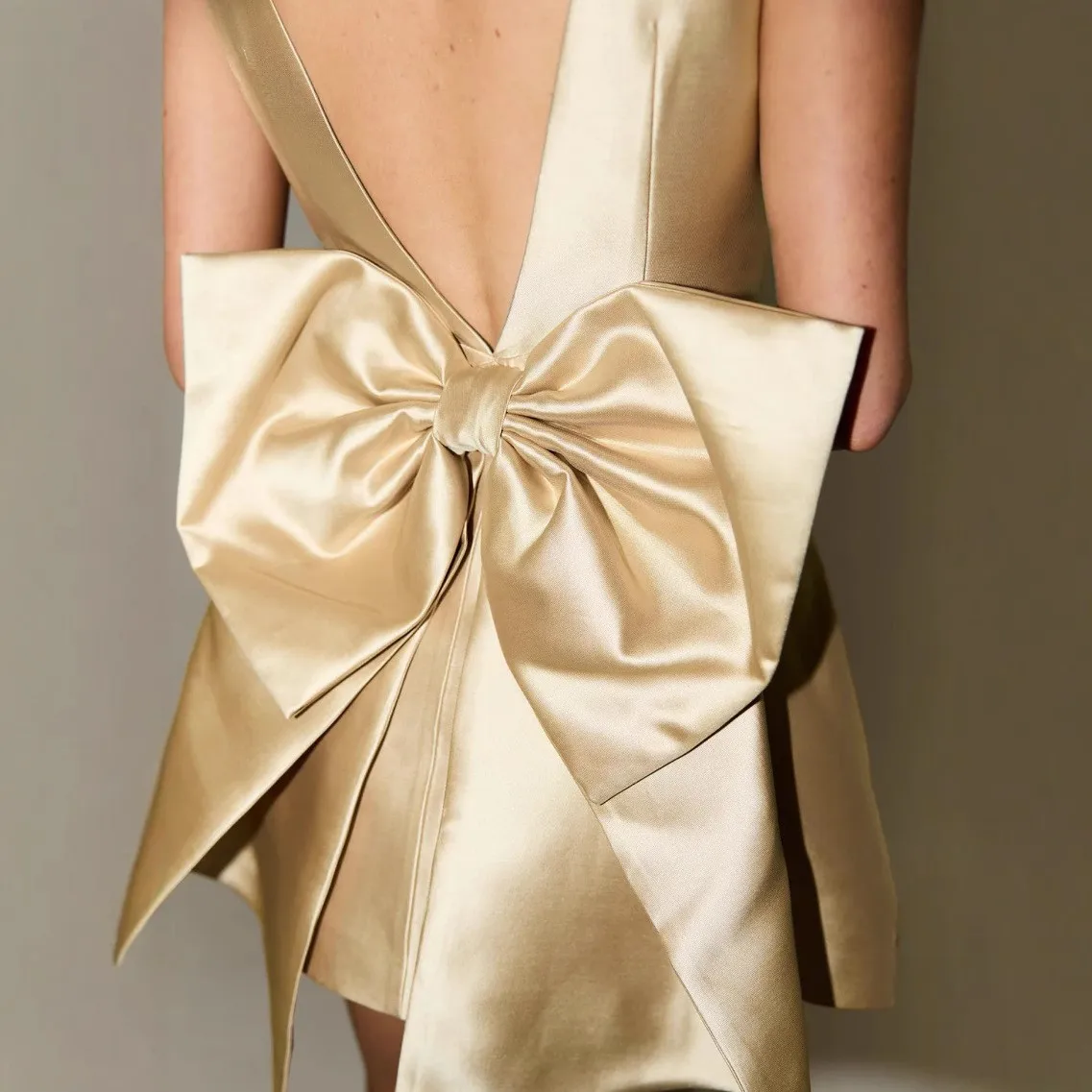 RITA - Gold Satin Holiday Mini Dress with Statement Bow